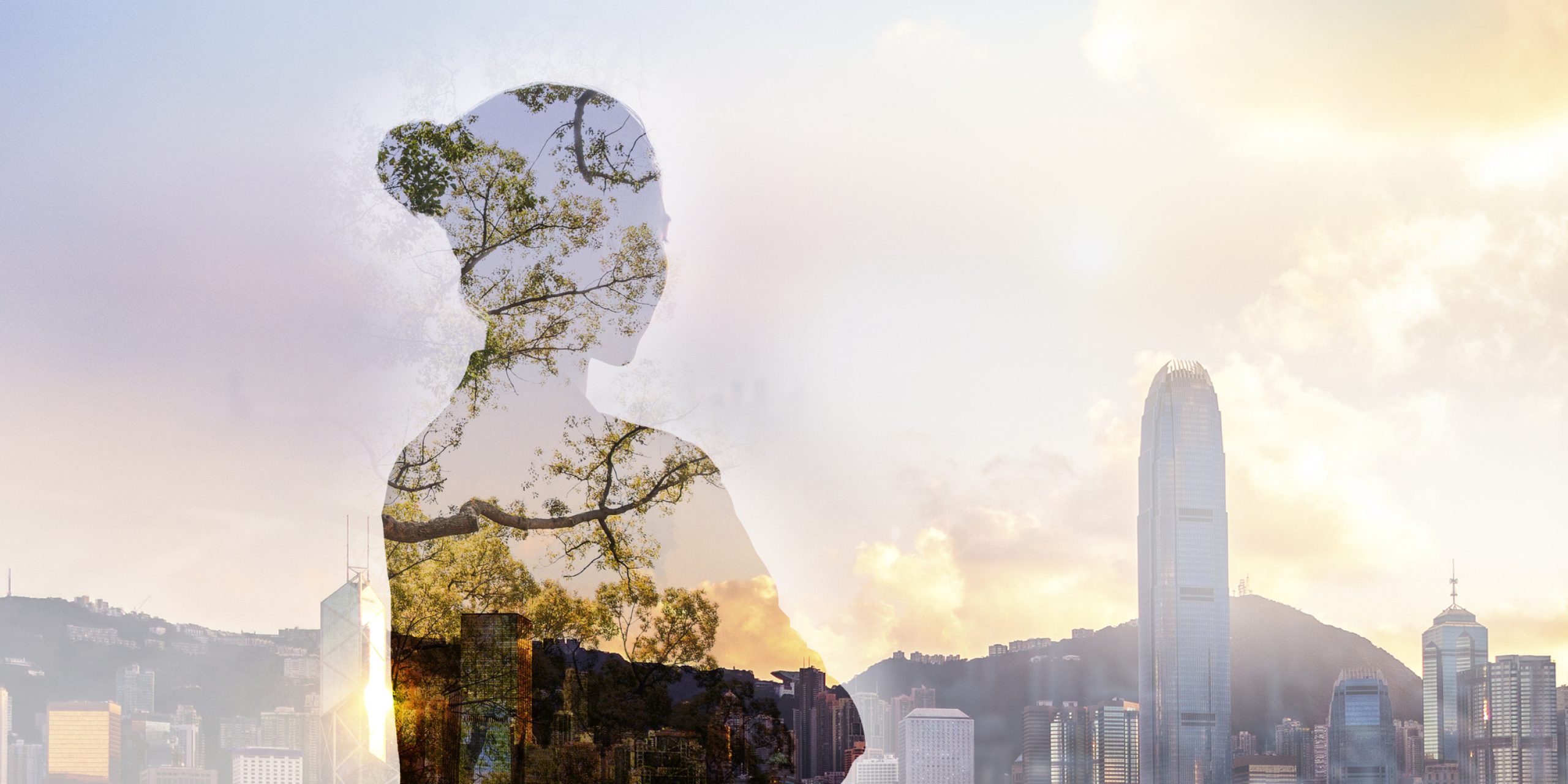 Person standing in contemplation in urban Hong Kong city reflection with nature trees
