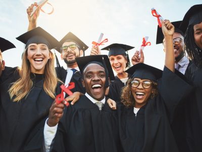 Shot of a group of cheerful university students on graduation day